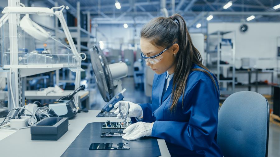 A technician assembling electronics